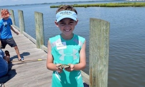 Young Boy Holding Blue Crab